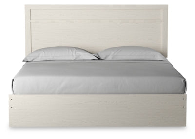 Cama King Stelsie con paneles, cómoda y mesita de noche