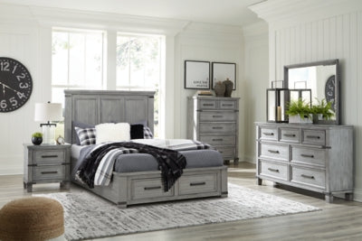 Cama Queen Russelyn con almacenamiento, tocador, espejo, cómoda y dos mesitas de noche