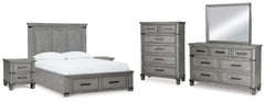 Cama Queen Russelyn con almacenamiento, tocador, espejo, cómoda y dos mesitas de noche