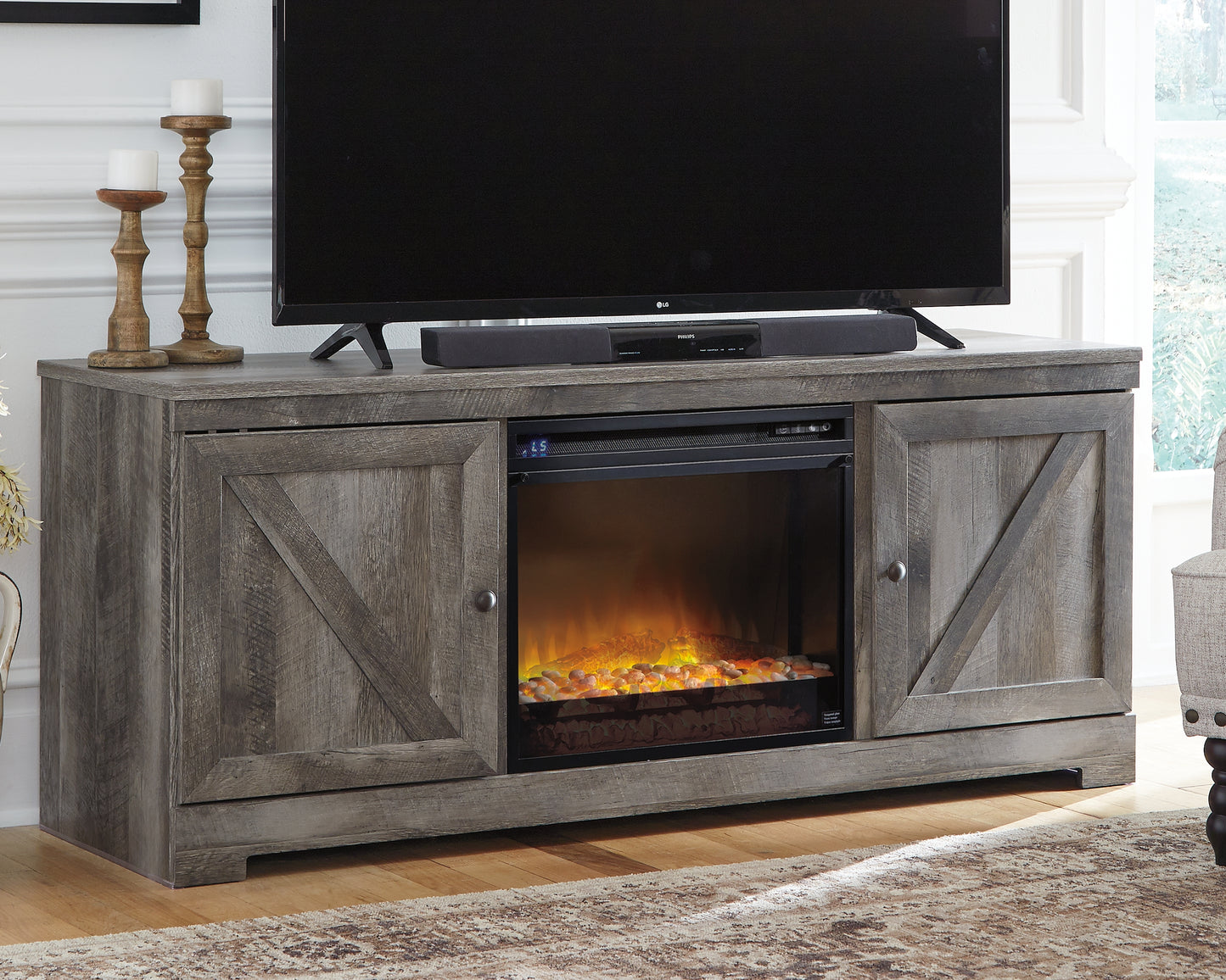 Mueble para TV Wynnlow de 63" con chimenea eléctrica