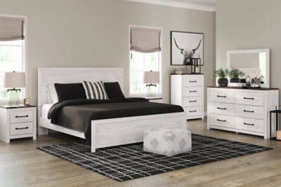 Cama Gerridan King con paneles, cómoda, arcón y dos mesitas de noche