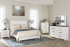 Cama Queen con paneles Gerridan, tocador, espejo y cómoda