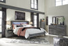 Cama Baystorm King con paneles, tocador, espejo, cómoda y dos mesitas de noche