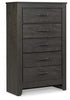 Cabecero Brinxton King con paneles, tocador, espejo, cómoda y dos mesitas de noche