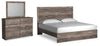Cama Ralinksi King con paneles, tocador y espejo