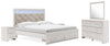 Cama King Altyra con almacenaje tapizado, tocador, espejo y dos mesitas de noche