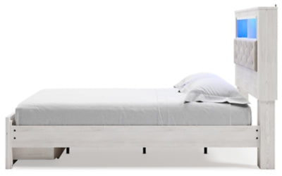 Cama Queen Altyra con librería tapizada y espacio de almacenamiento