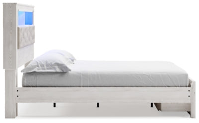 Cama Queen Altyra con librería tapizada y espacio de almacenamiento
