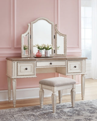 Realyn King Panel Bed, Dresser, Mirror, Chest, Vanity and Nightstand